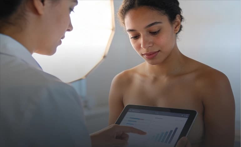 Provider reviewing InBody body composition results on a tablet with a patient