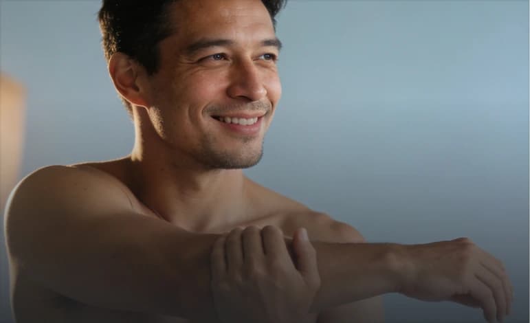 Man stretching after a workout, a Relive Health testosterone therapy patient profile